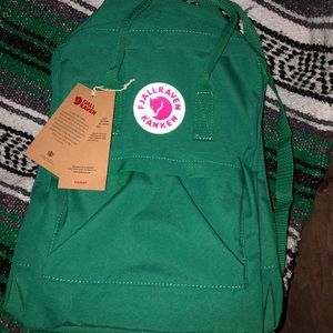 Green Fjallraven Kanken backpack.